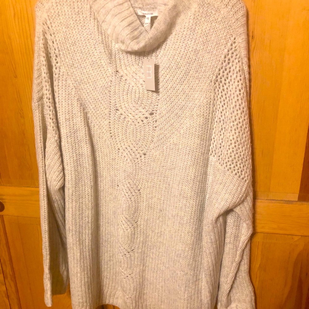 Maurice’s grey sweater